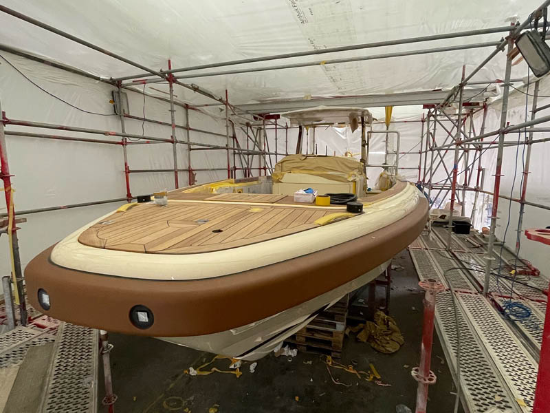 A yacht tender is being worked on